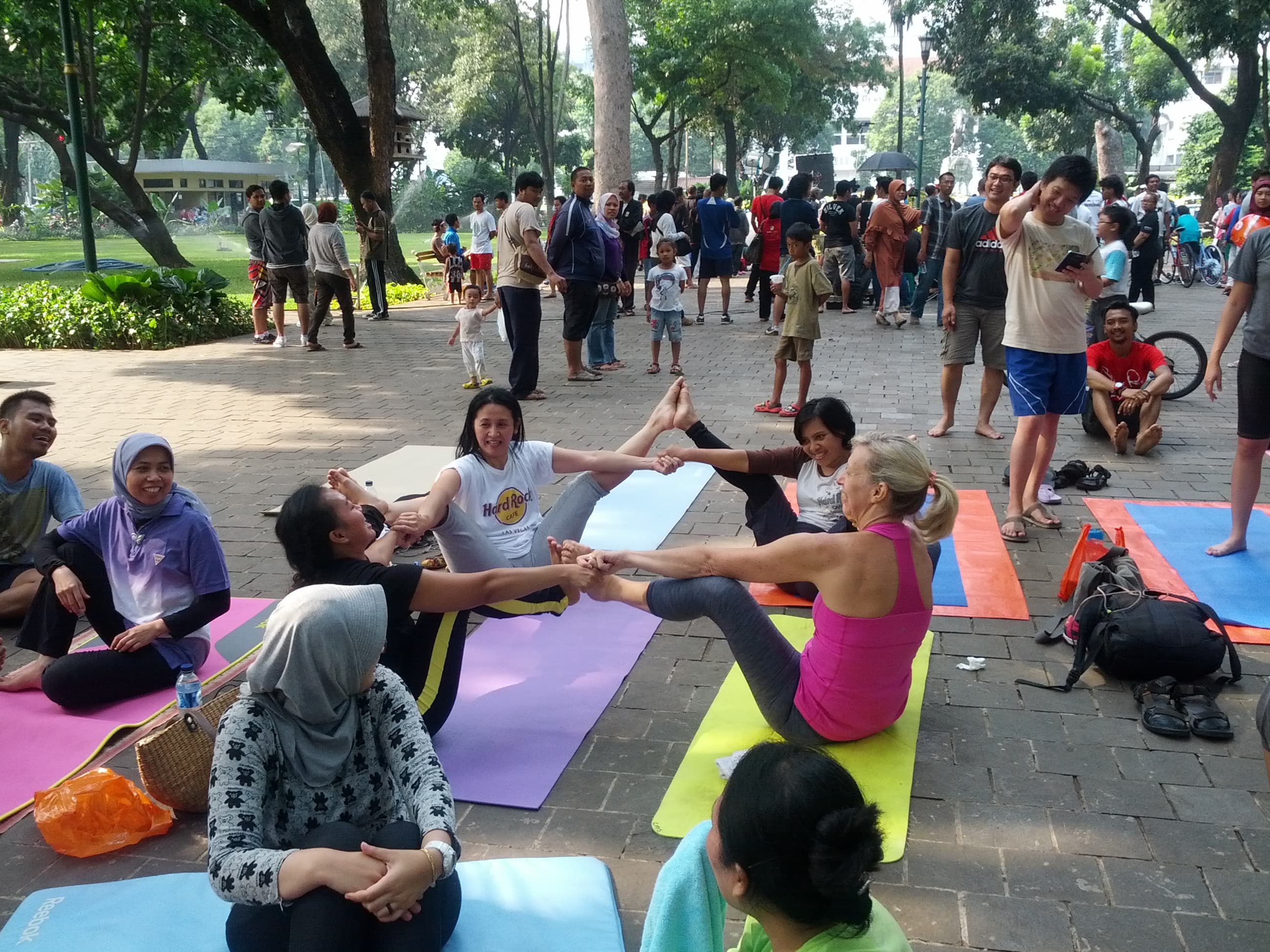 People gathering outdoors in a relaxed group class